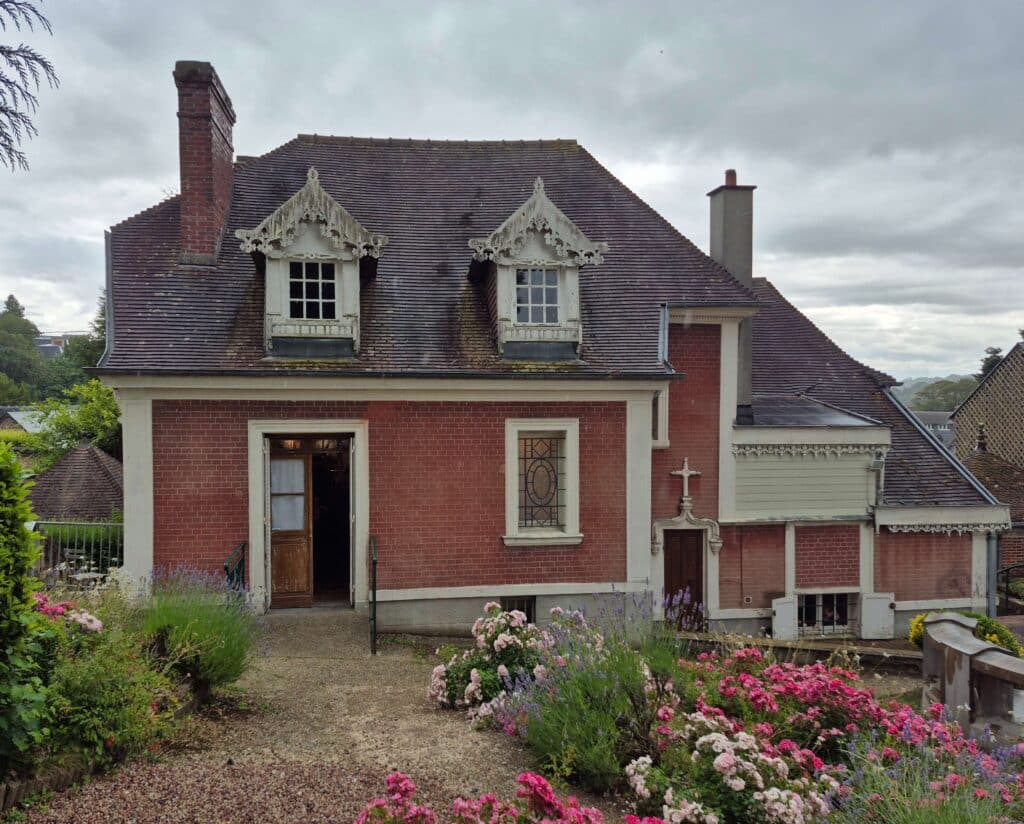 The rear and backyard of the childhood home of St. Therese