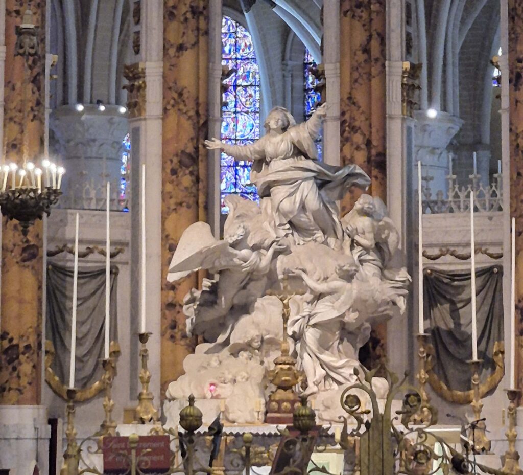 The High Altar of Chartres Cathedral featuring the monumental white marble 'Assumption of the Virgin' statue by Bridan